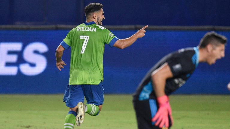 Cristian Roldan's double helped Seattle Sounders stay top of the Western Conference