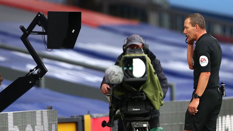 Kevin Friend used the pitchside monitor to decide on Everton's handball penalty