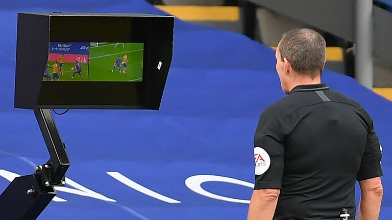 Kevin Friend uses the pitchside monitor 