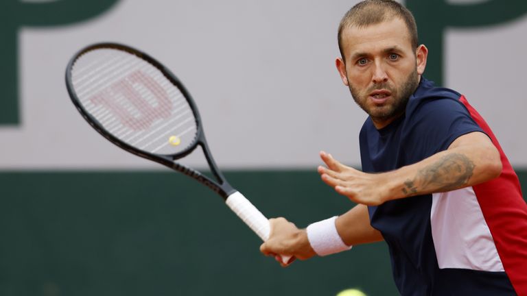 Britain's Dan Evans plays a forehand return to Japan's Kei Nishikori during their men's singles first round tennis match on Day 1 of The Roland Garros 2020 French Open tennis tournament in Paris on September 27, 2020.