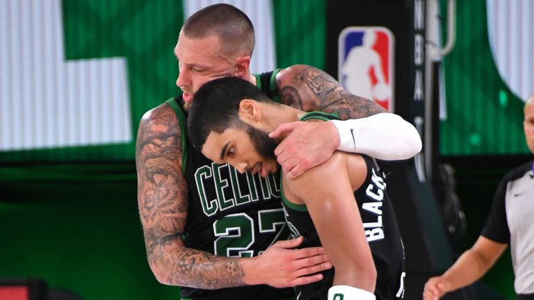 Daniel Theis hugs Celtics' team-mate Jayson Tatum during Boston's Game 5 win over the Miami Heat