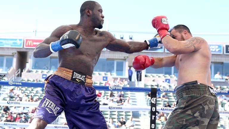 LOS ANGELES, CA - AUGUST 16:  Deontay Wilder (L) lands a punch on Jason Gavern in their heavywieght fight at StubHub Center on August 16, 2014 in Los Angeles, California.  (Photo by Stephen Dunn/Getty Images)