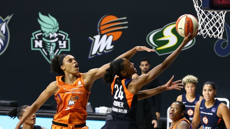 DeWanna Bonner of the Connecticut Sun drives to the basket against the Phoenix Mercury