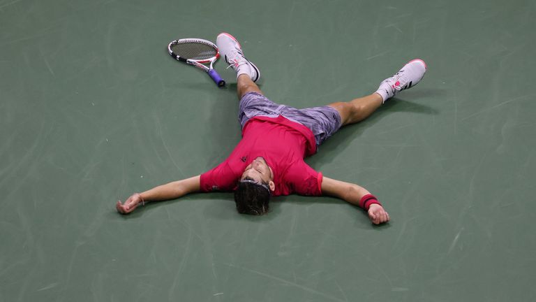 Dominic Thiem of Austria lays down in celebration after winning championship point after a tie-break during his Men's Singles final match against and Alexander Zverev of Germany on Day Fourteen of the 2020 US Open at the USTA Billie Jean King National Tennis Center on September 13, 2020 in the Queens borough of New York City.