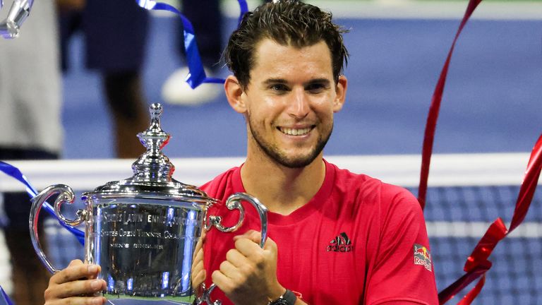 Dominic Thiem of Austria celebrates with the championship trophy after winning in a tie-breaker during his Men's Singles final match against Alexander Zverev of Germany on Day Fourteen of the 2020 US Open at the USTA Billie Jean King National Tennis Center on September 13, 2020 in the Queens borough of New York City.