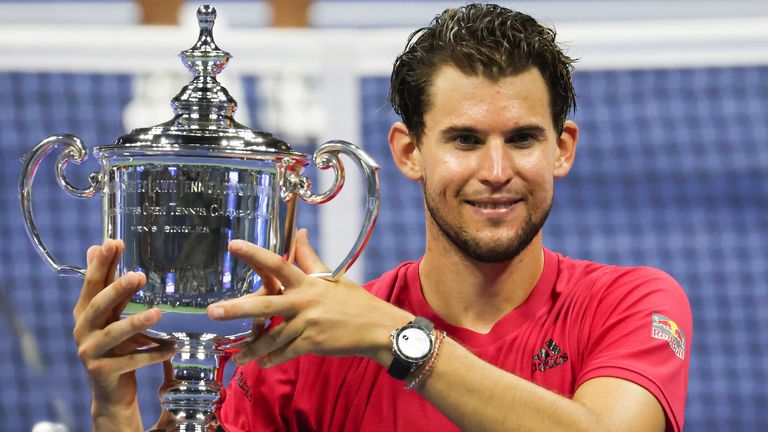Dominic Thiem of Austria celebrates with the championship trophy after winning in a tie-breaker during his Men's Singles final match against Alexander Zverev of Germany on Day Fourteen of the 2020 US Open at the USTA Billie Jean King National Tennis Center on September 13, 2020 in the Queens borough of New York City