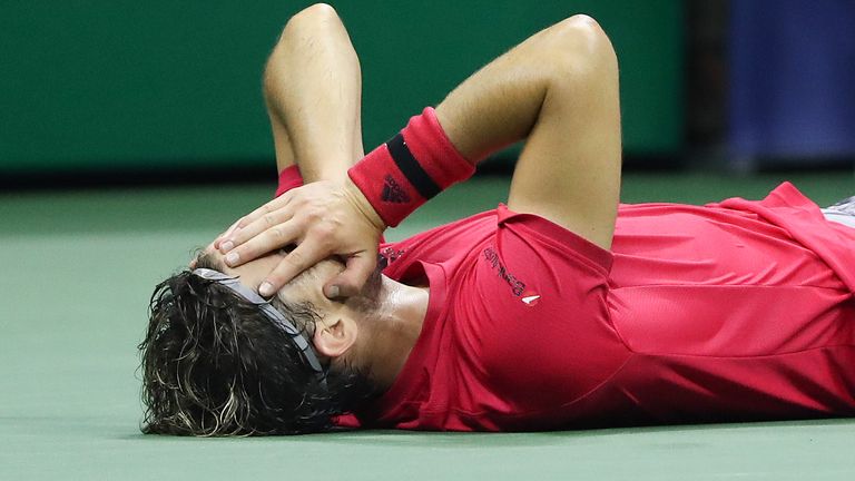 Dominic Thiem of Austria lays down in celebration after winning championship point after a tie-break during his Men's Singles final match against and Alexander Zverev of Germany on Day Fourteen of the 2020 US Open at the USTA Billie Jean King National Tennis Center on September 13, 2020 in the Queens borough of New York City