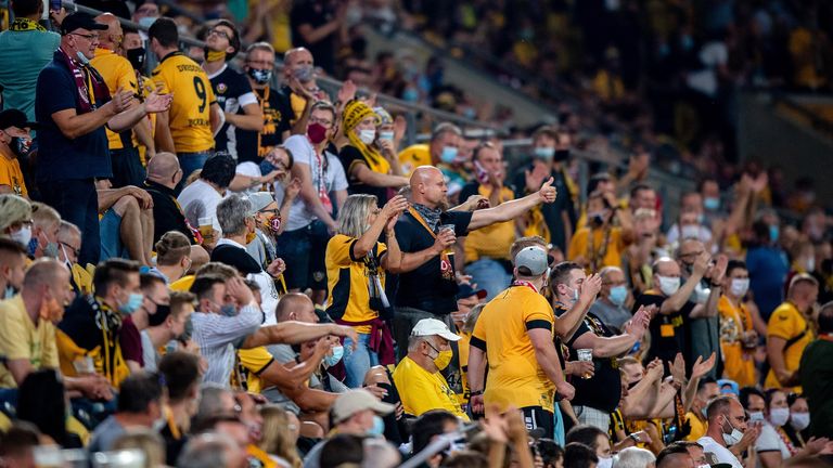 DRESDEN, GERMANY - SEPTEMBER 14: Fans of Dynamo Dresden react during the DFB Cup first round match between Dynamo Dresden and Hamburger SV at Rudolf-Harbig-Stadion on September 14, 2020 in Dresden, Germany. (Photo by Thomas Eisenhuth/Getty Images)