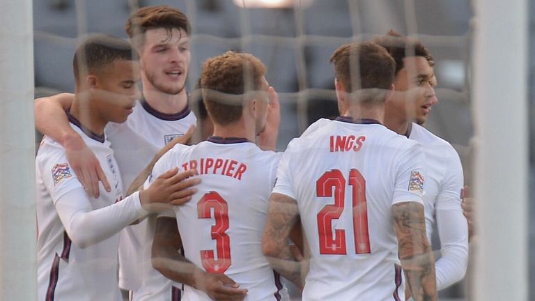 England players celebrate Raheem Sterling's late penalty