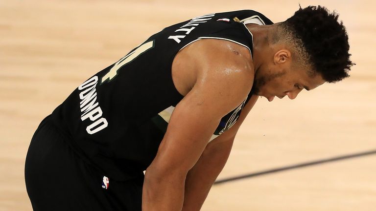 A fatigued and disappointed Giannis Antetokounmpo pictured at the conclusion of Milwaukee's Game 2 loss to Miami