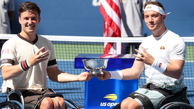 Gordon Reid (L) and Alfie Hewett (R) of Great Britain celebrate with the trophy after winning their Wheelchair Men's Doubles final match against Stephane Houdet and Nicolas Peifer of France on Day Thirteen of the 2020 US Open at the USTA Billie Jean King National Tennis Center on September 12, 2020 in the Queens borough of New York City