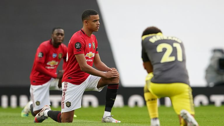 Mason Greenwood takes a knee before Manchester United&#39;s game against Southampton