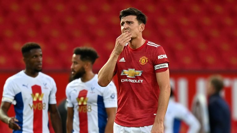 Harry Maguire cuts a dejected figure after Palace extend their lead