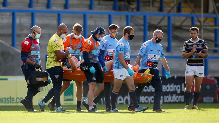 Picture by Ed Sykes/SWpix.com - 24/09/2020 - Rugby League - Betfred Super League - Hull KR v Leeds Rhinos - Halliwell Jones Stadium, Warrington, England - Leeds Rhinos' Harry Newman leaves the pitch on a stretcher after sustaining an injury
