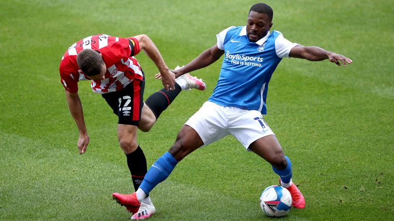 Henrik Dalsgaard and Jeremie Bela battle for the ball