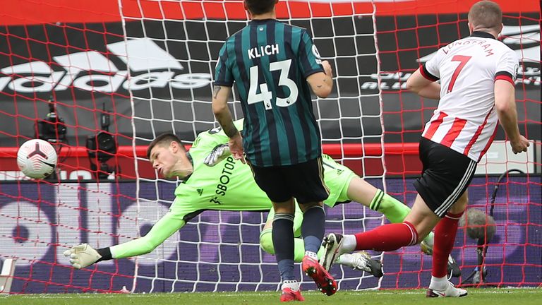 Leeds United goalkeeper Illan Meslier makes a save from John Lundstram at close range