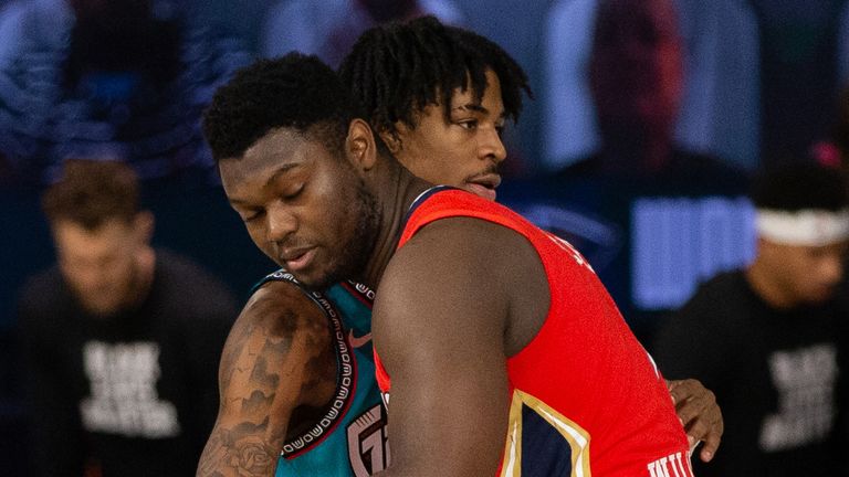 Rookie stars Ja Morant and Zion Williamson share a hug before a Grizzlies-Pelicans game