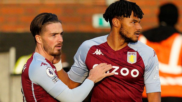 Aston Villa's English midfielder Jack Grealish (L) celebrates scoring the opening goal with Aston Villa's English defender Tyrone Mings during the English Premier League football match between Fulham and Aston Villa at Craven Cottage in London on September 28, 2020. 