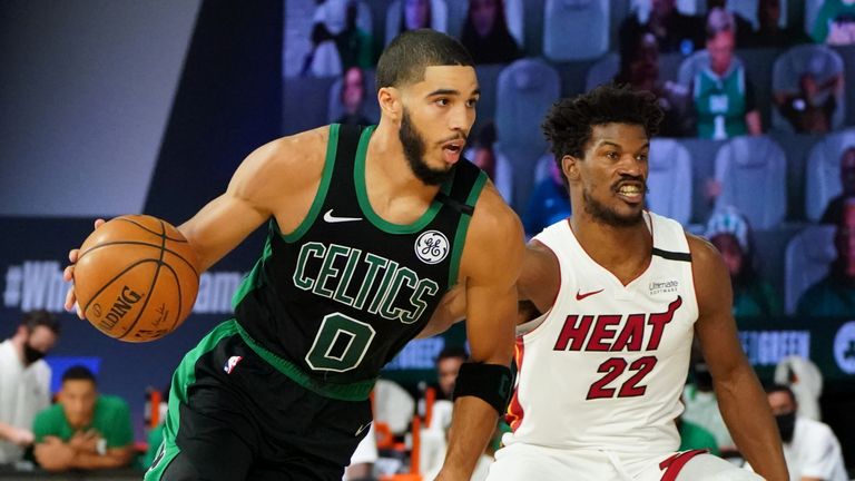 Jayson Tatum of the Boston Celtics handles the ball against Jimmy Butler of the Miami Heat during Game One of the Eastern Conference Finals 