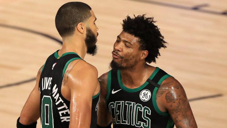 Jayson Tatum and Marcus Smart celebrate during the Celtics' Game 2 win over the Raptors