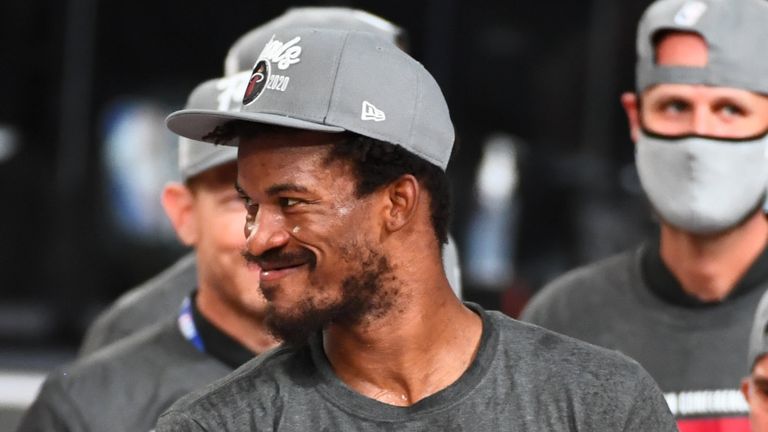 Jimmy Butler prepares to receive the trophy after the Miami Heat beat the Boston Celtics to become Eastern Conference champions