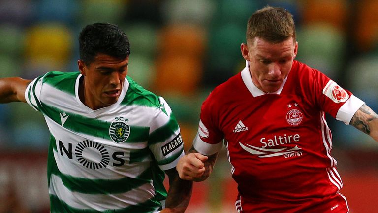 Jonny Hayes battles for the ball in Portugal 