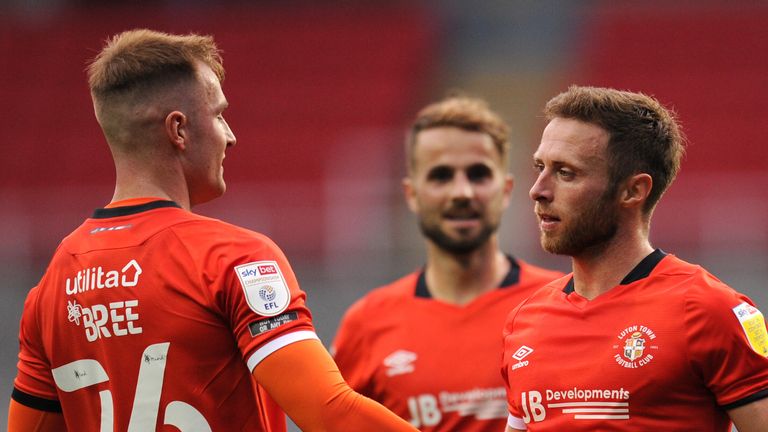 Jordan Clark's fine header set up Luton's third-round clash with Manchester United