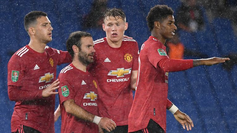 Juan Mata celebrates with team-mates after putting Manchester United 2-0 up at Brighton