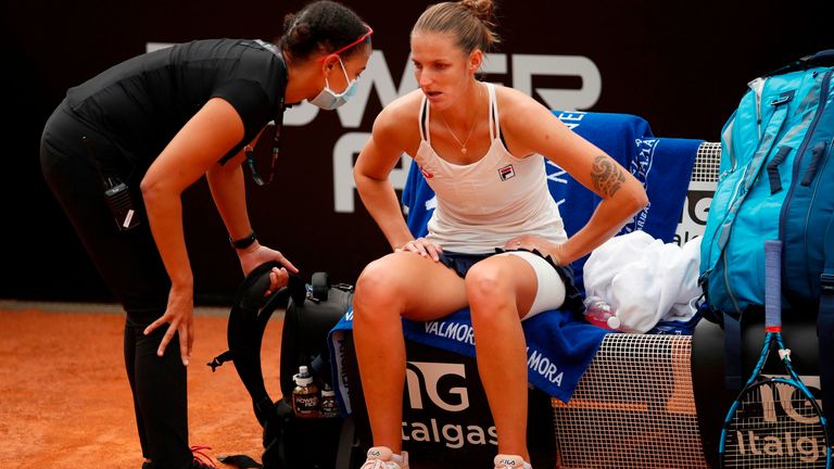 Czech Republic's Karolina Pliskova talks with her therapist during the final match of the Women's Italian Open against Romania's Simona Halep at Foro Italico on September 21, 2020 in Rome, Italy.