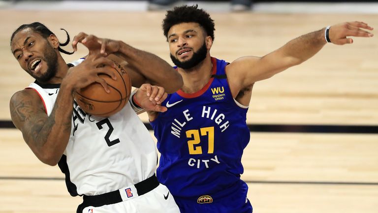 Leonard drives the ball against Murray during the Clippers' Game 5 defeat