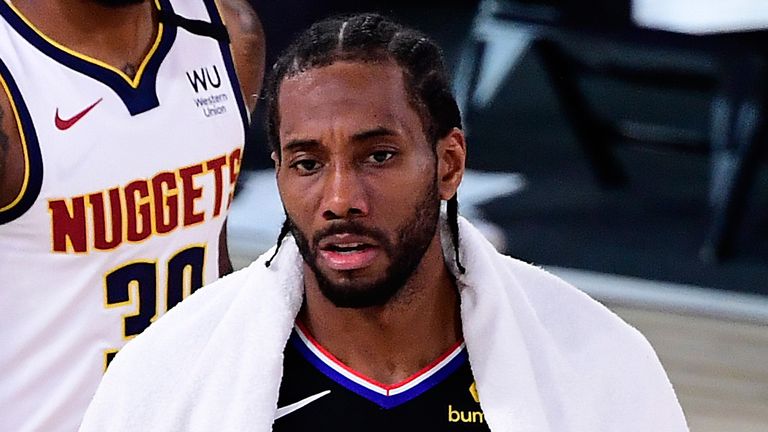A dejected Kawhi Leonard walks off the court after the Clippers were eliminated by the Nuggets