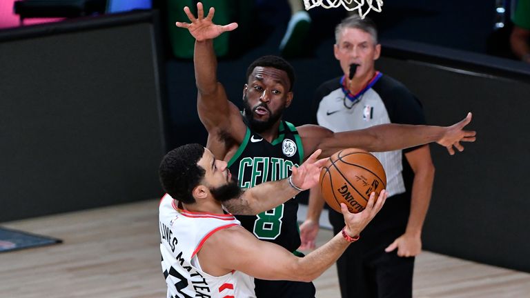 Walker looks to defend VanVleet during the Celtics' win over the Raptors