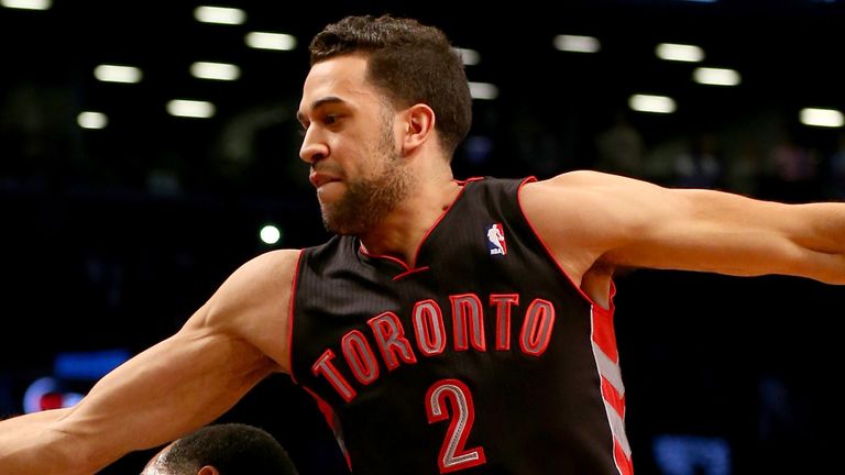 Landry Fields reaches to claim a rebound for the Toronto Raptors