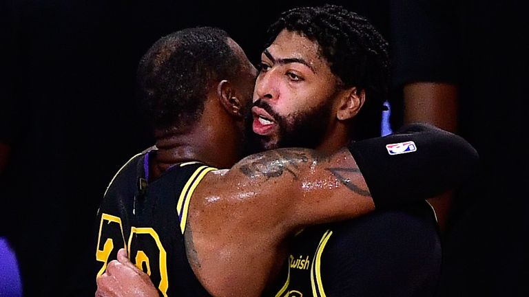 LeBron James hugs Anthony Davis after the Lakers' Game 2 win