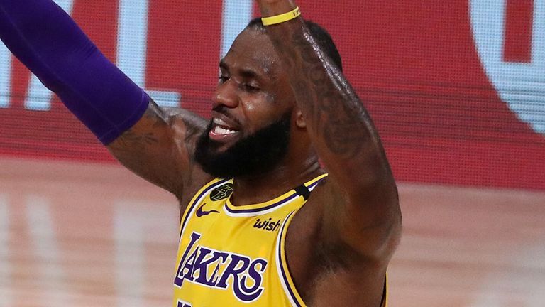 LeBron James celebrates with his team-mates during the Lakers&#39; Game 4 win over the Rockets