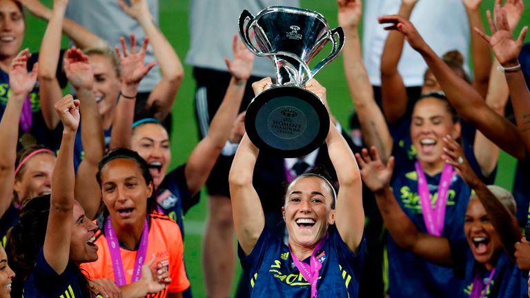 Lucy Bronze lifts her third Women's Champions League trophy