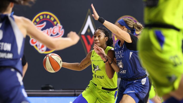 Tyasha Harris of the Dallas Wings shoots the ball against the Minnesota Lynx