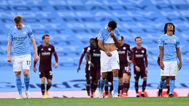 Manchester City players react to conceding another goal at home to Leicester