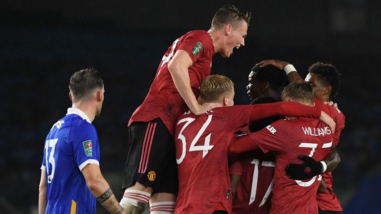 Manchester United celebrate as Paul Pogba makes it 3-0 against Brighton