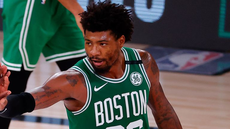 Marcus Smart high-fives team-mate Kemba Walker during the Celtics&#39; Game 3 win over the Miami Heat