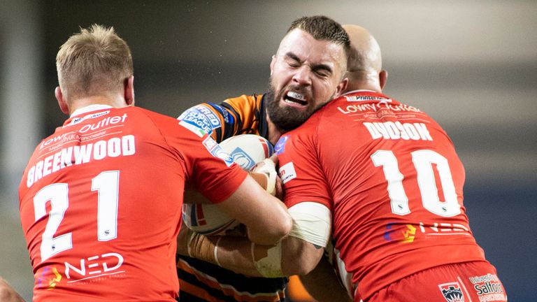 Picture by Isabel Pearce/SWpix.com - 03/09/2020 - Rugby League - Betfred Super League - Salford Red Devils v Castleford Tigers - Emerald Headingley Stadium, Leeds, England - Mike McMeeken of Castleford is tackled by James Greenwood and Gil Dudson of Salford.