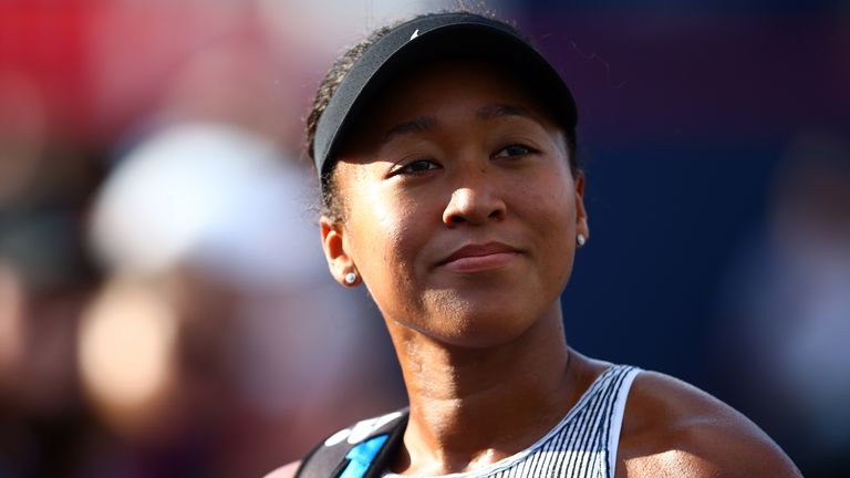 Naomi Osaka of Japan smiles for pictures with fans following a second round match victory over Tatjana Maria of Germany on Day 5 of the Rogers Cup at Aviva Centre on August 07, 2019 in Toronto, Canada