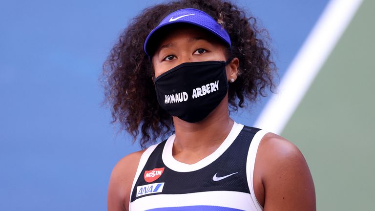 Naomi Osaka of Japan wears a protective face mask with the name, Ahmaud Arbery stenciled on it after winning her Women's Singles third round match against Marta Kostyuk of the Ukraine on Day Five of the 2020 US Open at USTA Billie Jean King National Tennis Center on September 04, 2020 in the Queens borough of New York City. Ahmaud Arbery, an unarmed 25-year-old African-American man, was pursued and fatally shot while jogging in Glynn County, Georgia.