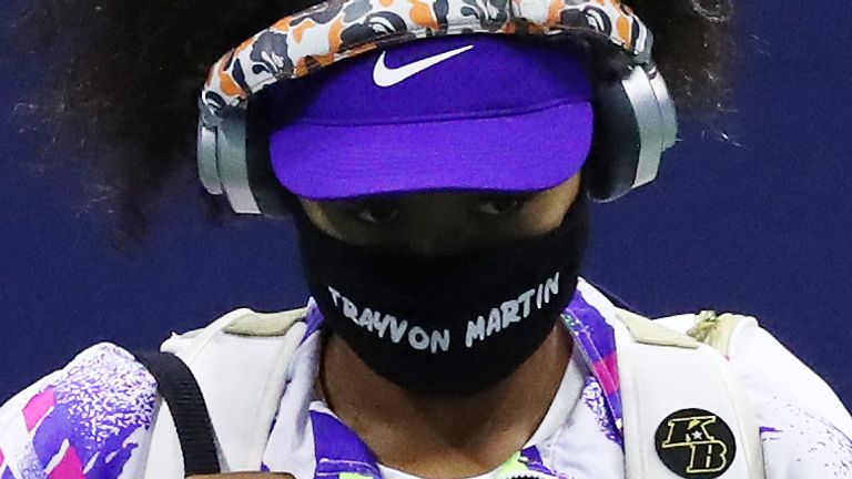 Naomi Osaka of Japan walks out wearing a mask with the name of Trayvon Martin printed on it before her Women’s Singles fourth round match against Anett Kontaveit of Estonia on Day Seven of the 2020 US Open at the USTA Billie Jean King National Tennis Center on September 6, 2020 in the Queens borough of New York City