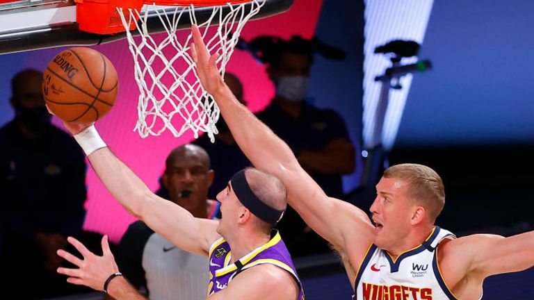 Alex Caruso #4 of the Los Angeles Lakers drives to the basket against Mason Plumlee #7 of the Denver Nuggets during the second quarter in Game Five of the Western Conference Finals during the 2020 NBA Playoffs at AdventHealth Arena at the ESPN Wide World Of Sports Complex on September 26, 2020 in Lake Buena Vista, Florida. 