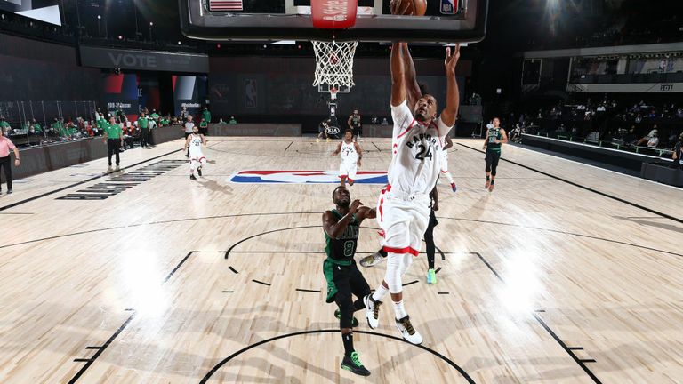 Marcus Smart #36 of the Boston Celtics blocks the shot by Norman Powell #24 of the Toronto Raptors during Game Seven of the Eastern Conference Semifinals of the NBA Playoffs on September 11, 2020 at The AdventHealth Arena at ESPN Wide World Of Sports Complex in Orlando, Florida.