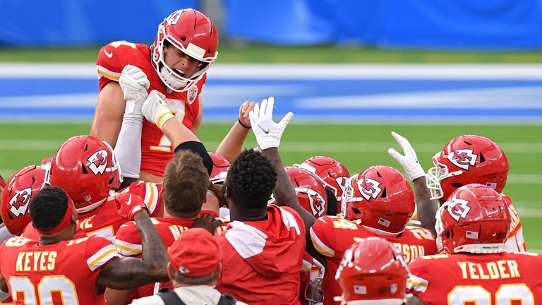 Kansas City&#39;s Harrison Butker kicked the winning field goal as the Chiefs overcame the Los Angeles Chargers 23-20 in overtime.