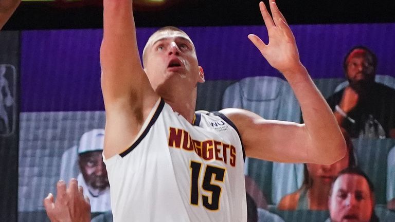 Nikola Jokic drives to the basket for a lay-up during Game 2 of the Western Conference Finals