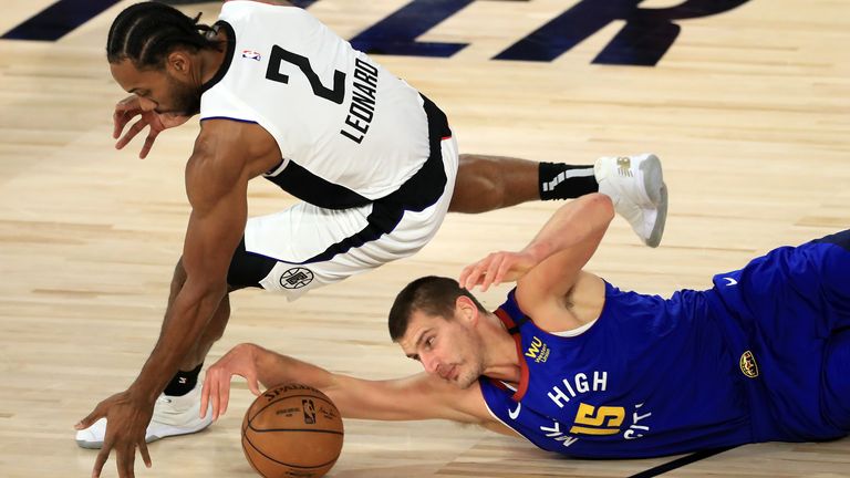 Jokic and Leonard scramble for the loose ball