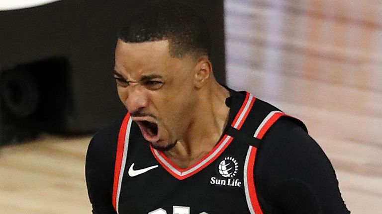 Norman Powell celebrates after scoring in overtime during the Raptors ' Game 6 win